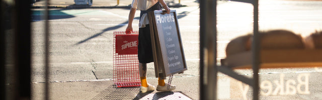 Coffee Supreme pavement sign outside of Florets